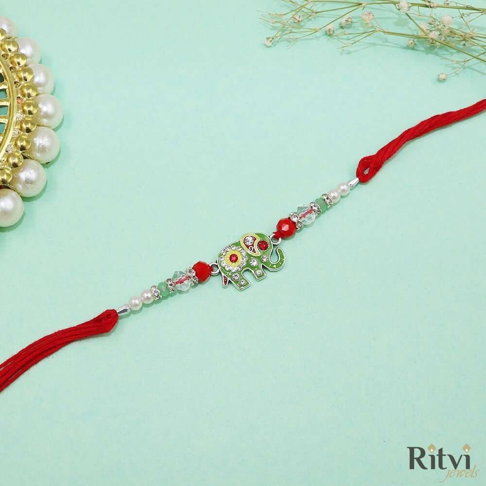 248.jpg Ritvi Green Rakhi 0109 - Image 1