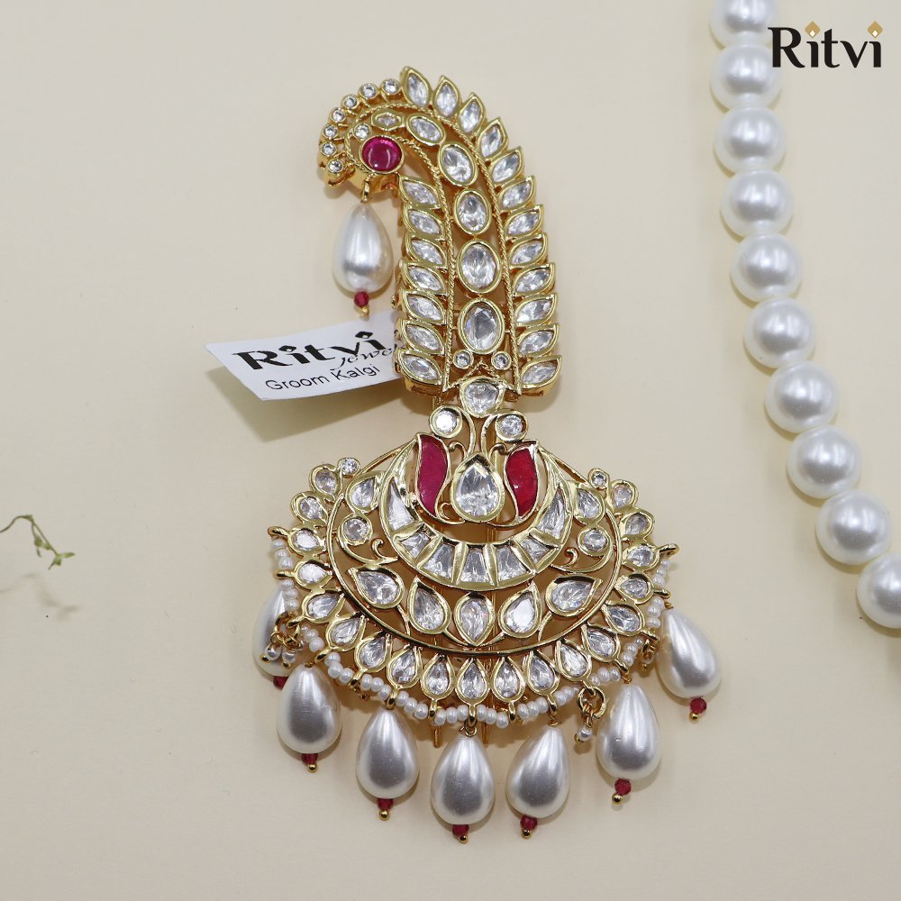 ayaan-kalgi-1.jpg Ritvi Vedant Gold Finished Pearl Kundan Kalgi (Ruby) - Image 1